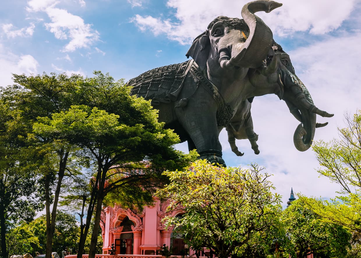 The three headed elephant statue towering over the gardens at the Erawan Museum in Bangkok.