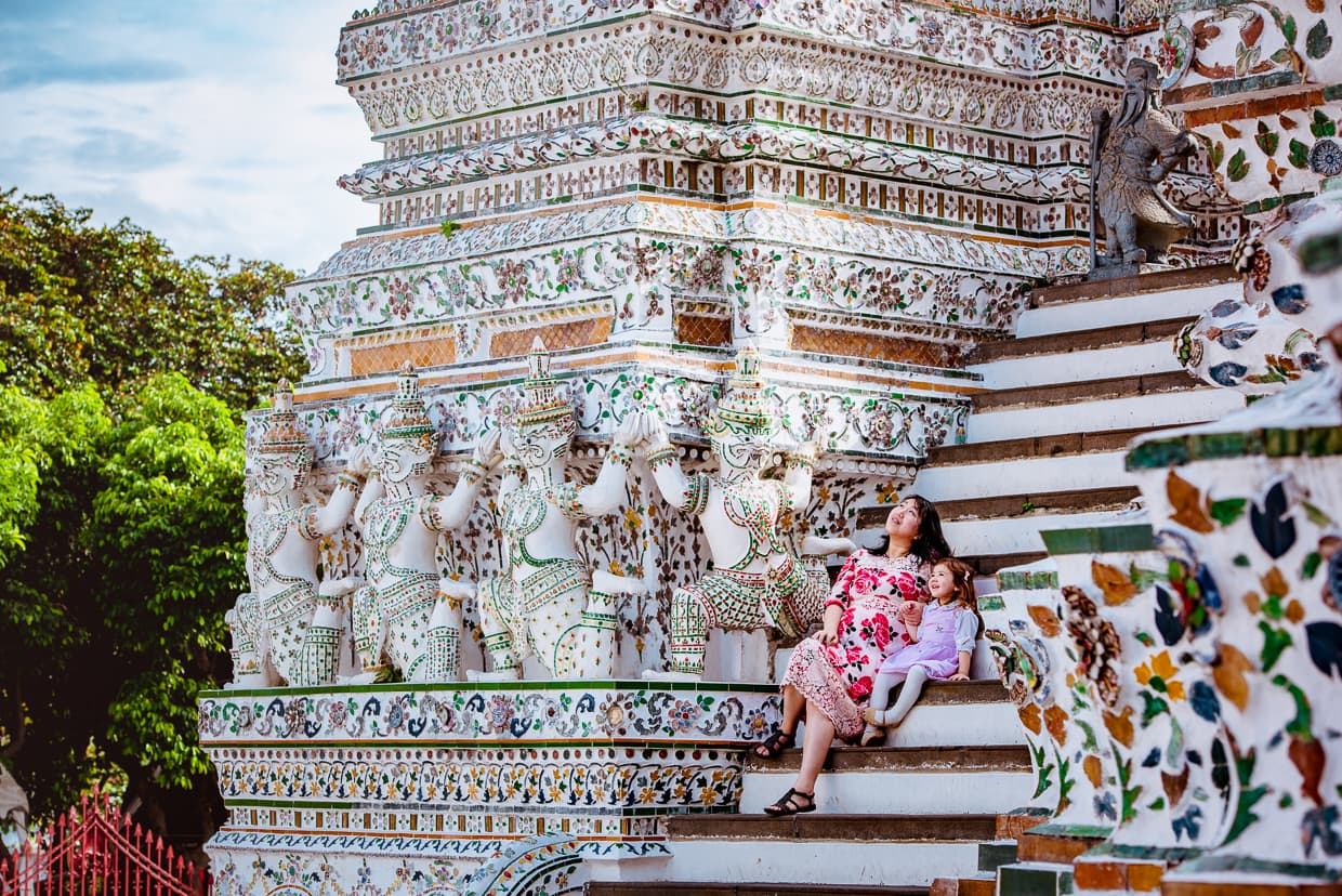 Dannie and Lisa sitting on the stairs of Wat Arun.