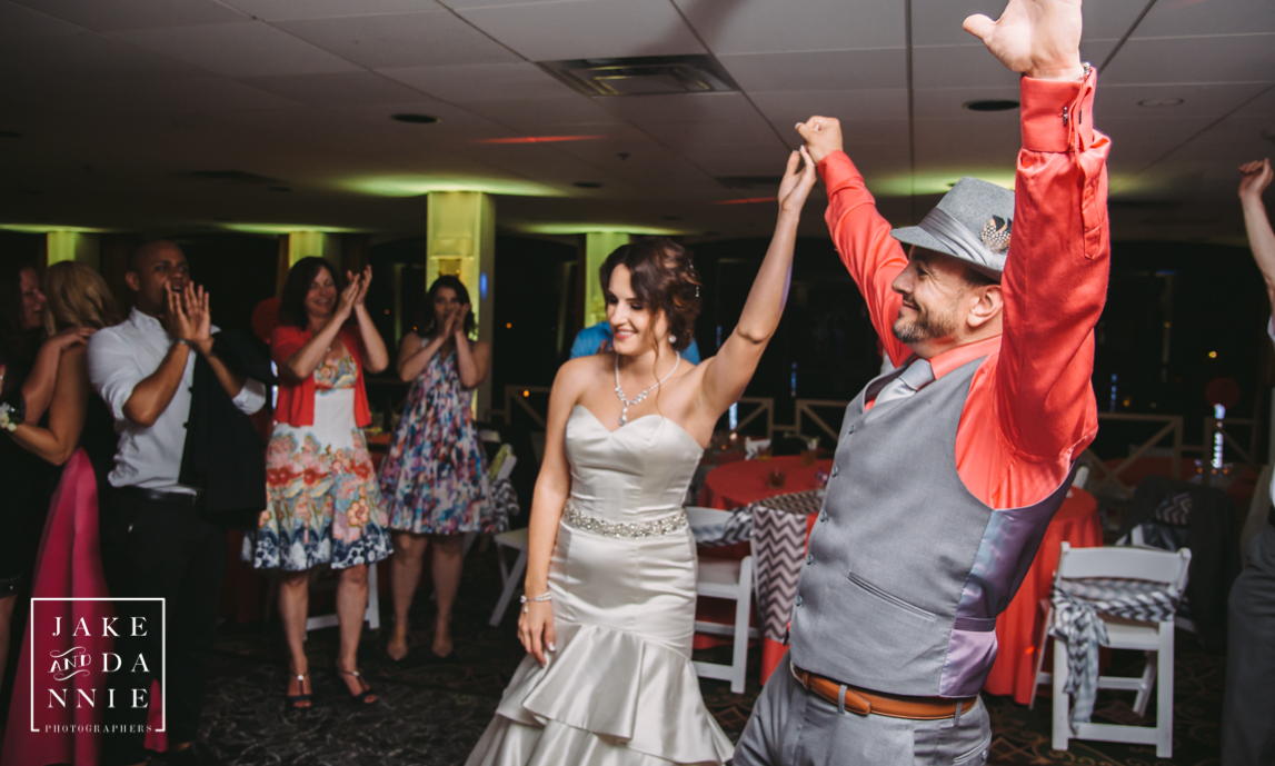 Florida bride and groom celebrate together at the end of their wedding reception