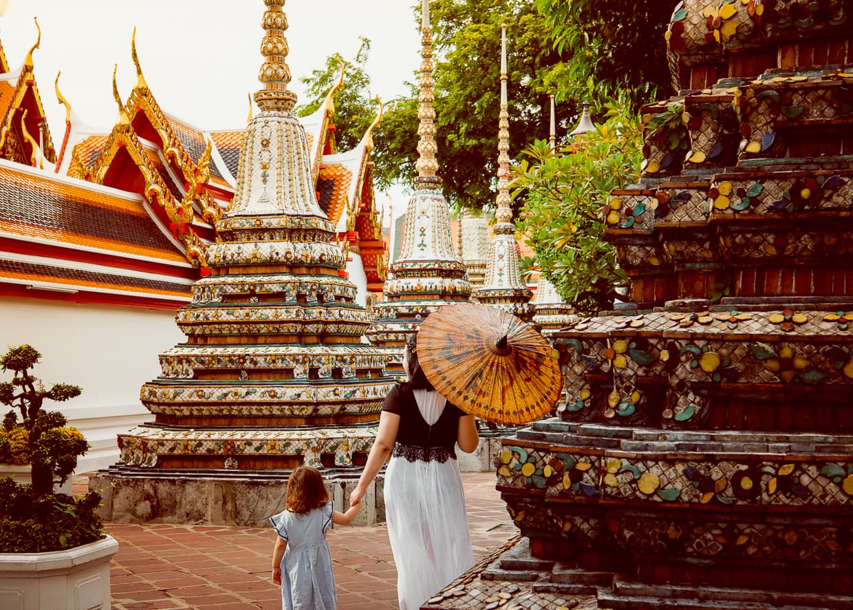 Walking by chedis in Wat Pho.