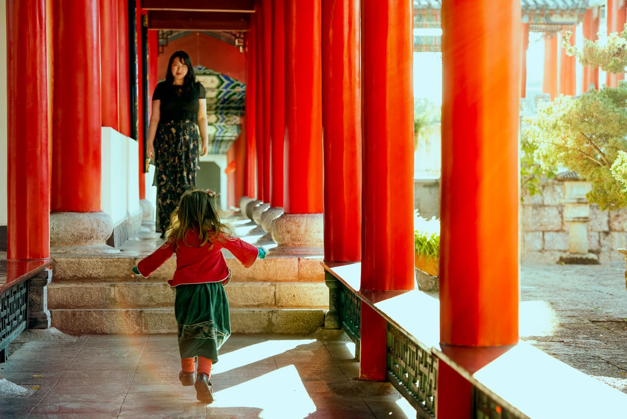 Toddler running to mother in Lijiang, China.