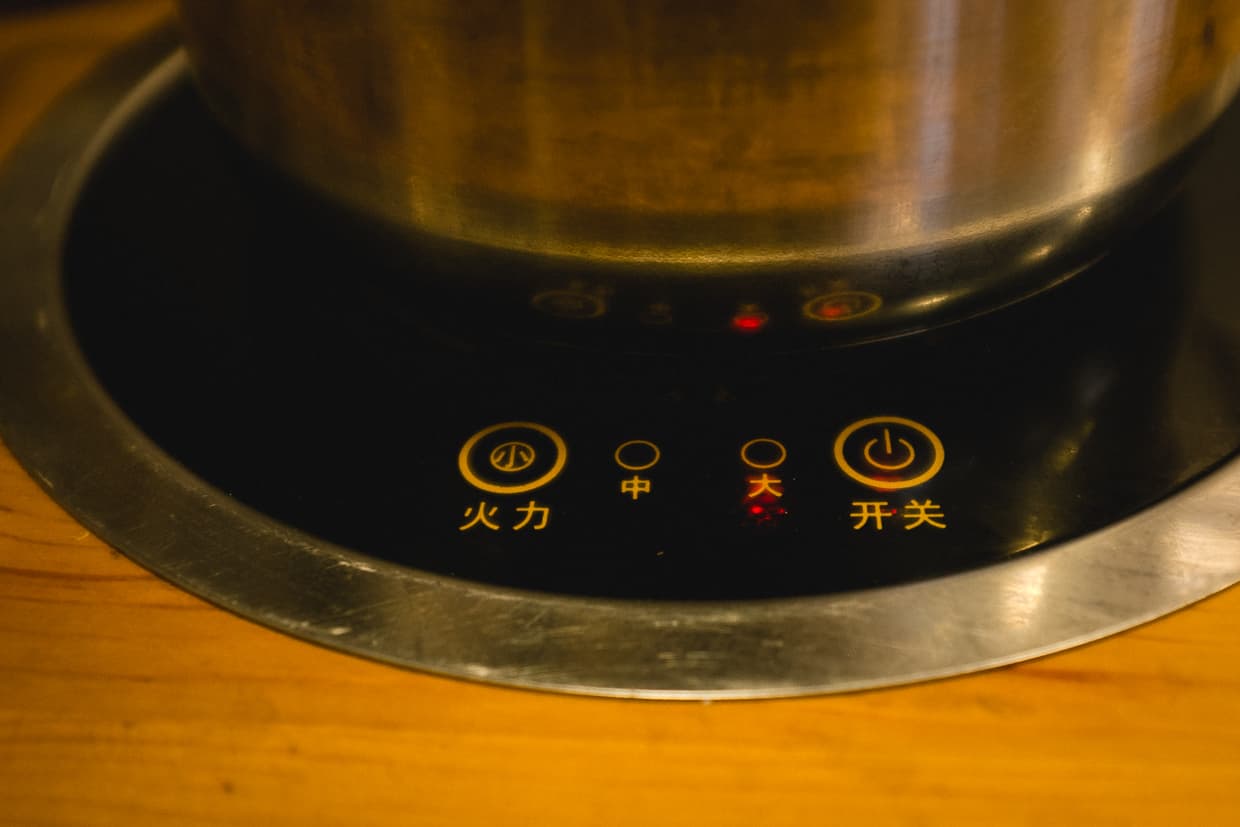 A hot pot cook top in a Dali, China vegetarian restaurant.