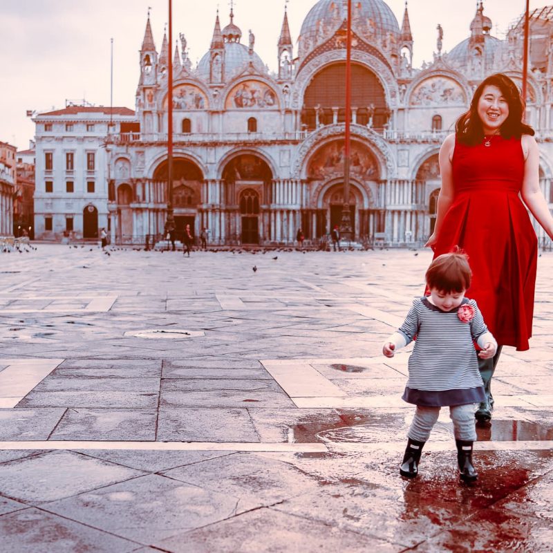 Playing in the puddles in Piazza San Marco in Venice, Italy.