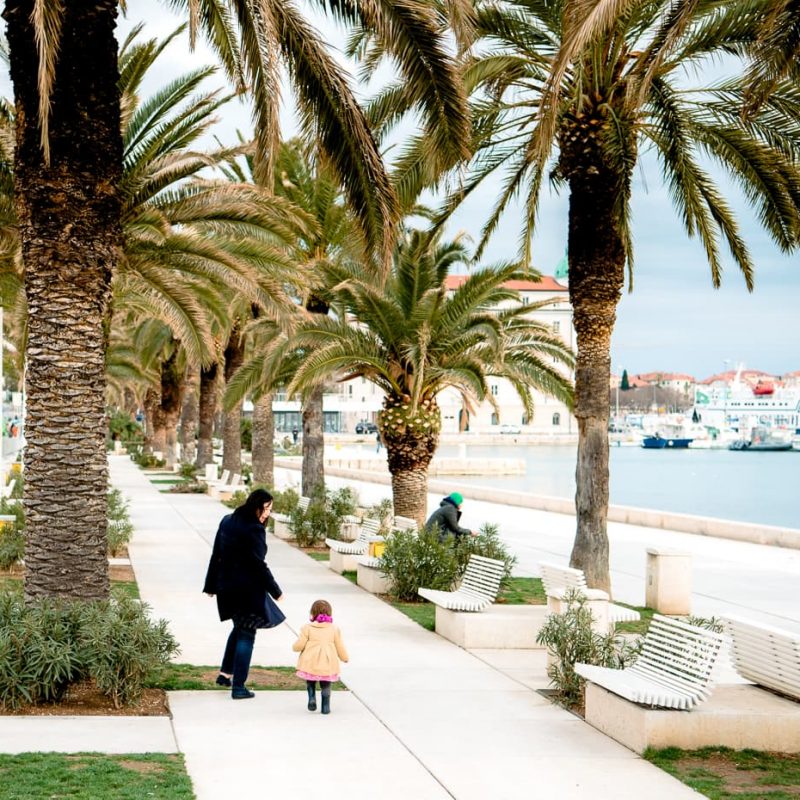 Walking down the waterfront promenade in Split, Croatia.