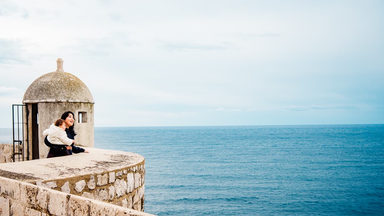 Enjoying the view of the Adriatic Sea beyond the city walls of Dubrovnik, Croatia.