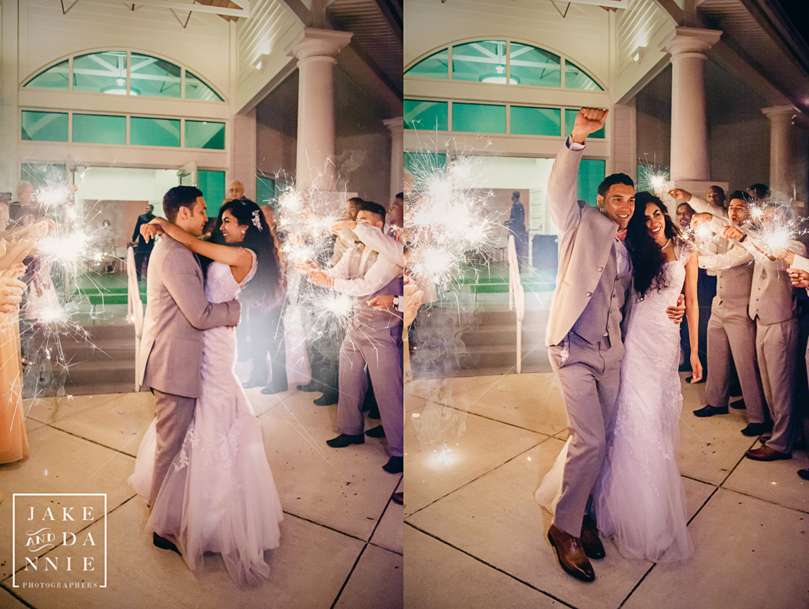 The bride and groom are sent off surrounded by sparklers.