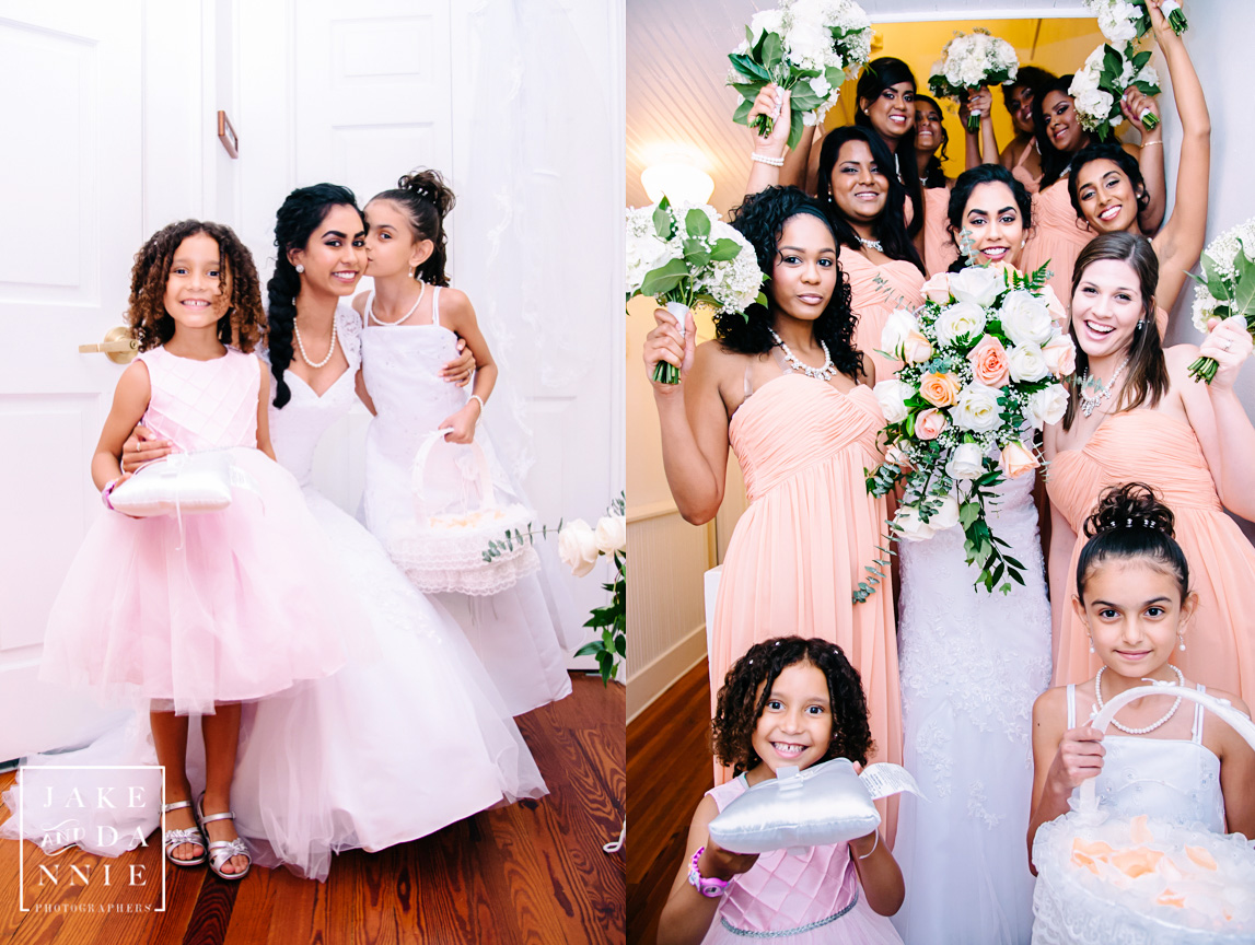 The bride poses with the ring bearer, flower girl and bridal party