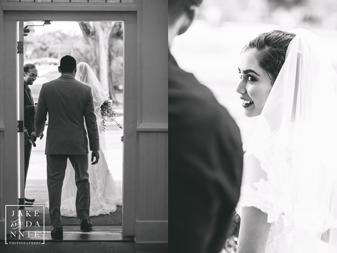 Bride and groom walking out door of White Chapel after wedding.