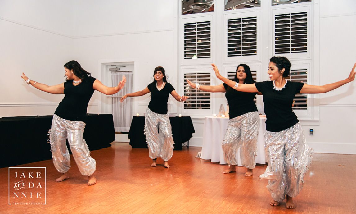 Bridesmaids peform indian dance during Florida wedding reception.