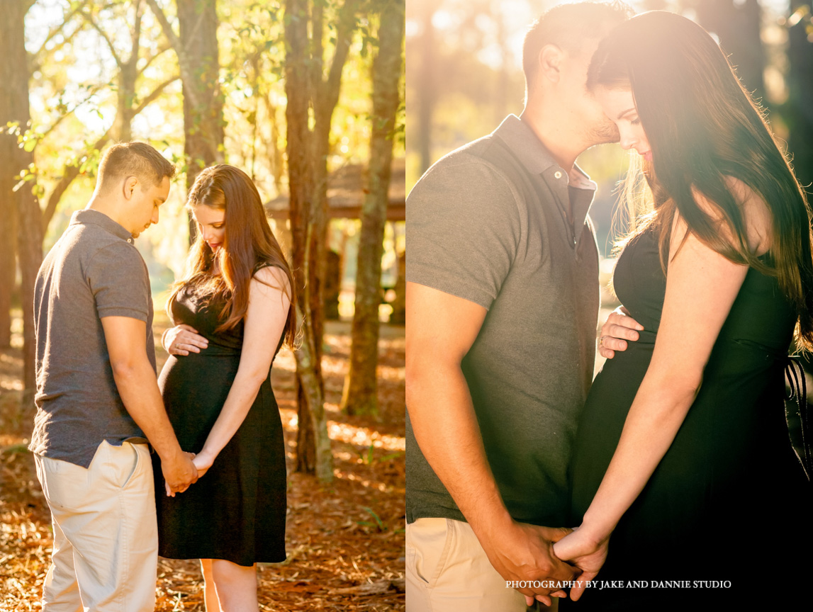 The sun shines down on a pregnant woman and her husband during their maternity photo session in the forest.