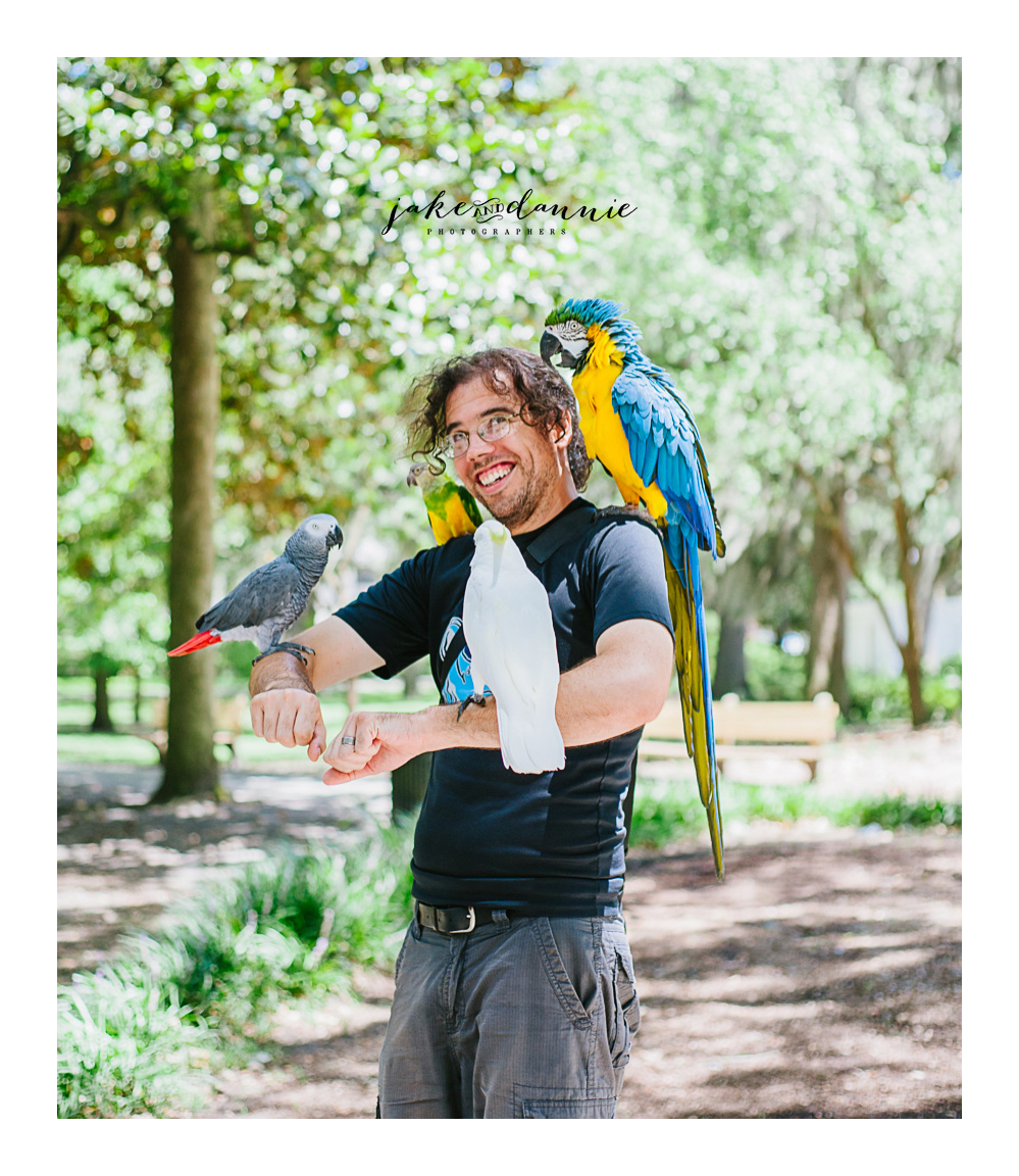 one more Forsyth Park travel photo of Jake covered in Parrots. Savannah Georgia