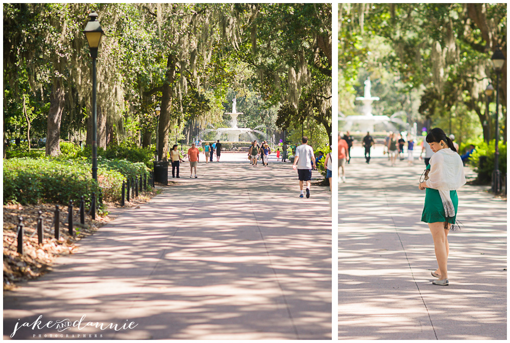 rows of live oaks line the path through Forsyth park in Savannah Georgia. Dannie poses for a photo