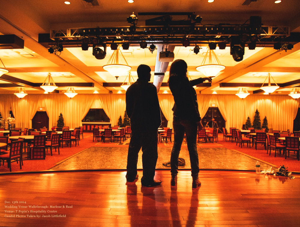 Marlene and Raul on the stage during their wedding venue walkthrough in Tampa, Florida