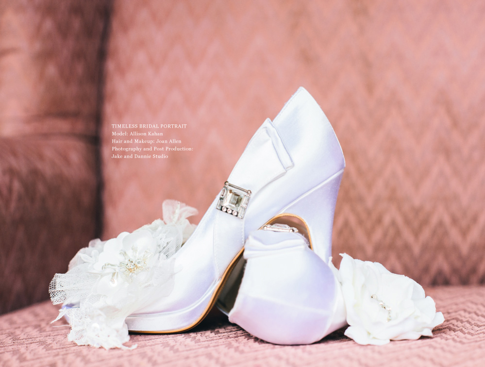 A bride's heels rest on the seat of a chair.