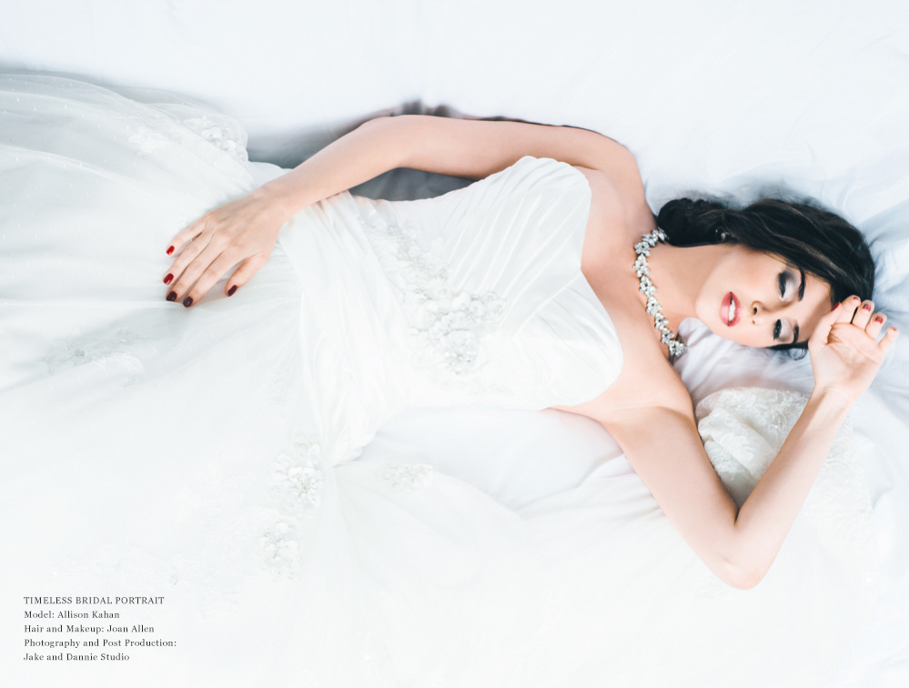 Resting on the bed during a bridal photography shoot