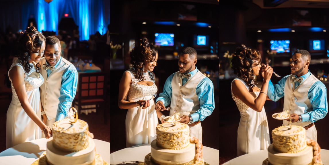 Bride and groom cut the wedding cake and feed each other slices