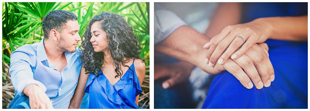 Couple face each other and show off engagement rings to photographer