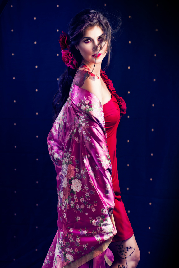 Beautiful model poses as geisha for halloween photo shoot