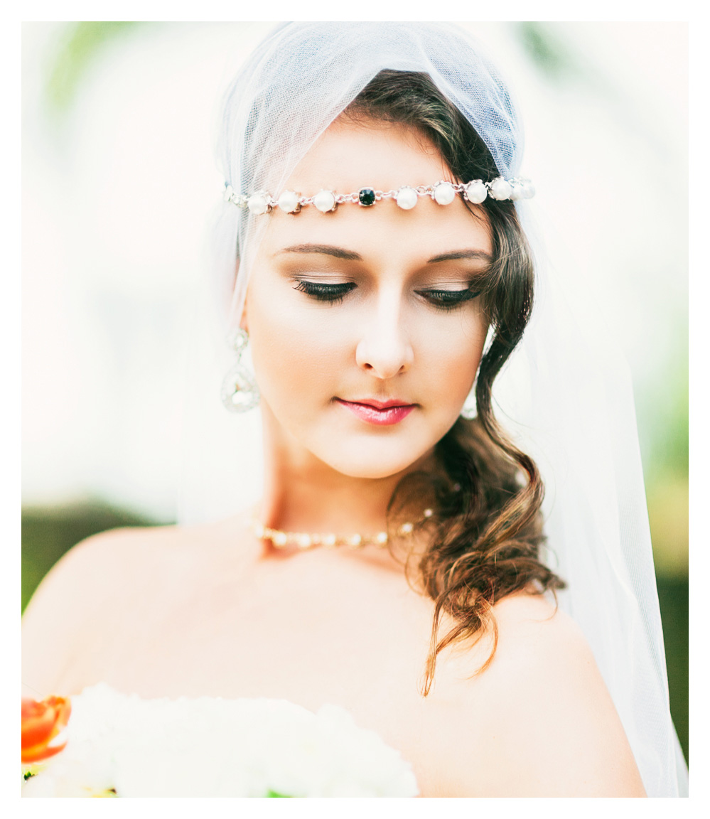 Closeup of bride with flowers wearing crystal head band