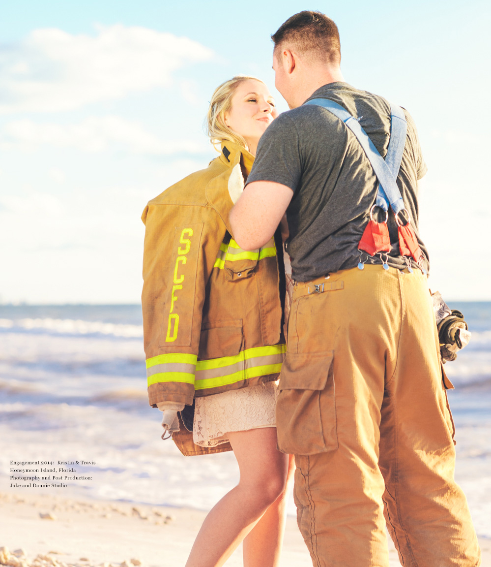 Firefighter puts his jacket over fiance's shoulders during engagement photo session