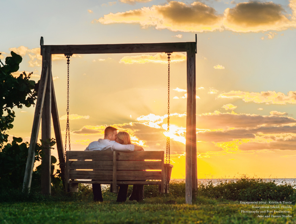 silhouette of couple on swing at sunset during engagement photo session